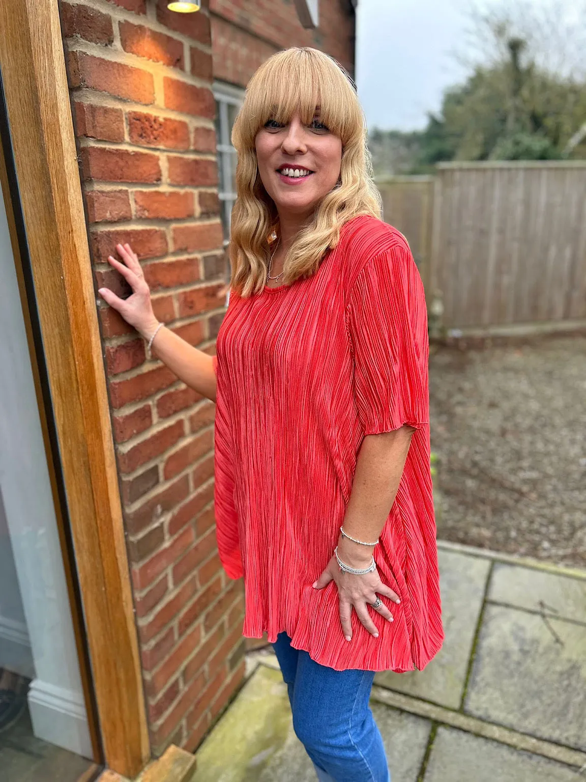 Coral Shimmer Pleated Blouse Bailey